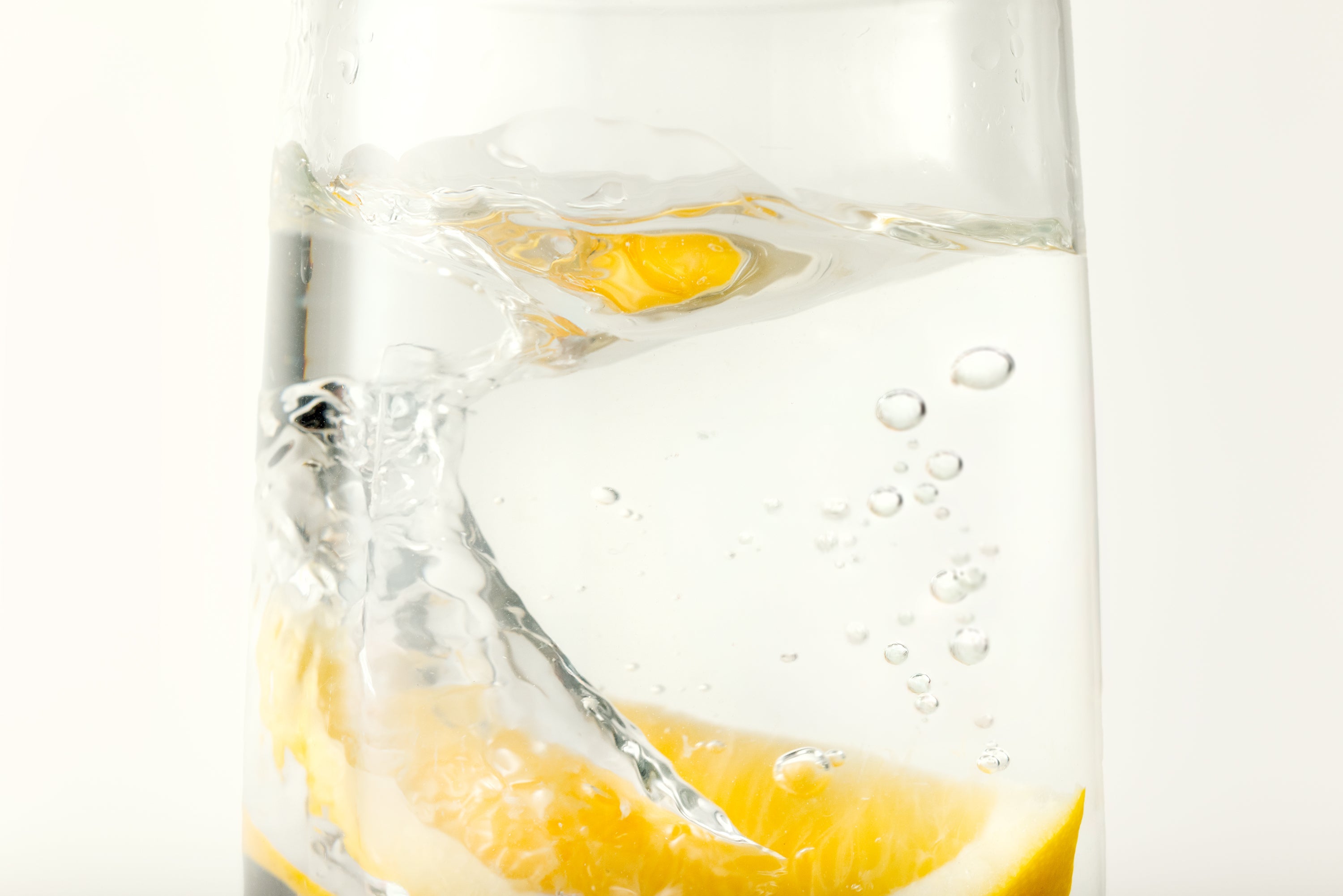 Glass of mineral water with slice of lemon